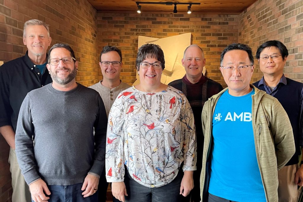 Picture of seven adults smiling