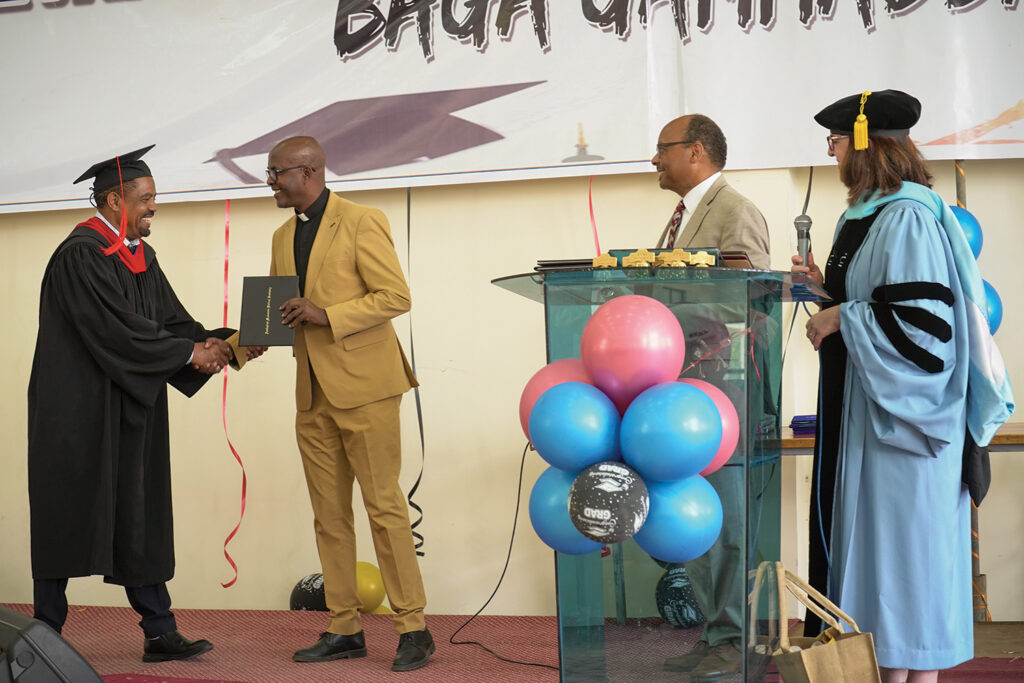 Girma Bossen (at left) receives his diploma from MKC President Desalegn Abebe. At right, Daniel B. Grimes, former Administrative Faculty member, and Beverly Lapp, Vice President and Academic Dean, represented AMBS at the May 20 Commencement Service.