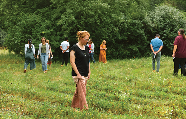 Incoming students walk the prayer labyrinth on the AMBS campus during the seminary’s orientation week in August 2025. The mowed labyrinth (Chartres design) provides a setting for spiritual renewal for individuals and small groups on AMBS’s 44-acre campus. (Credit: Brittany Purlee/AMBS)